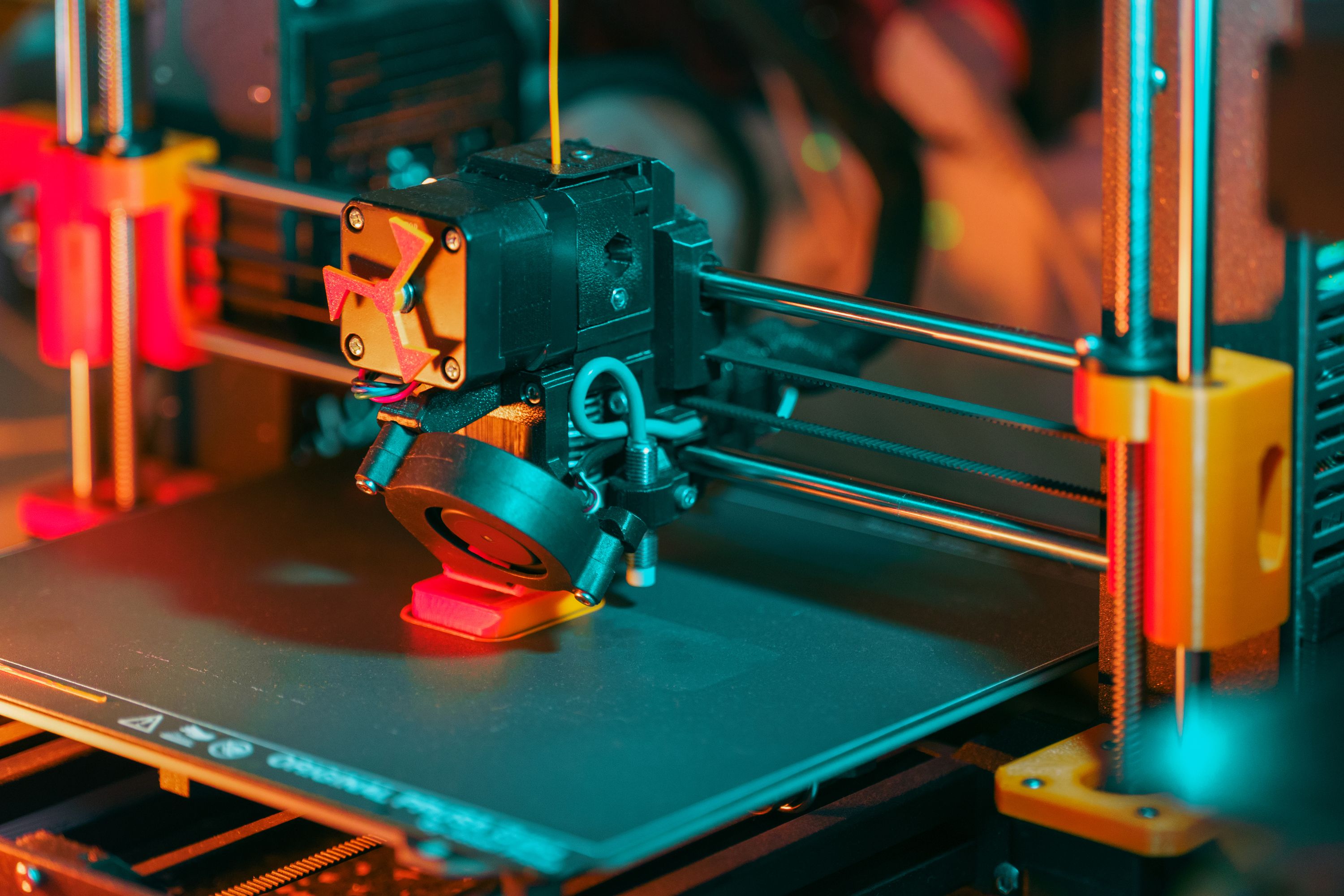 Close-up of a filament 3D printer making a part